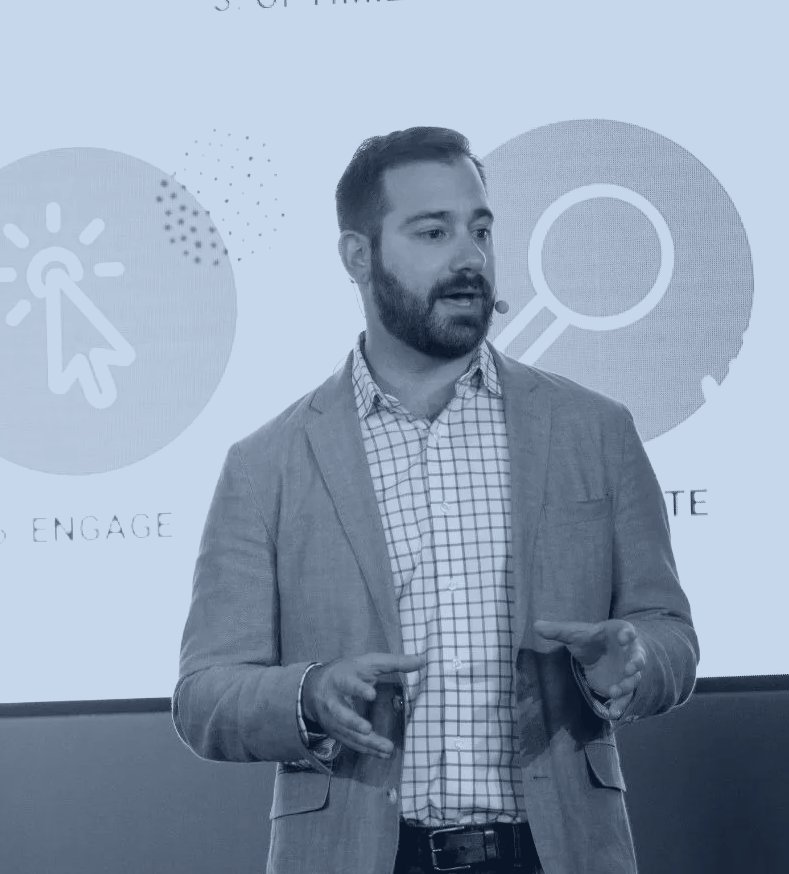 Jacob Davis speaking on stage at a Cheetah Digital event